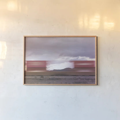 Boxcars by Nathan Larson. shown as a paper print in a natural frame. Available as a archival giclee rolled canvas, fine art paper, or poster print. SKU 96627i.