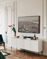 California Lighthouse BW by Nathan Larson. shown as a framed stretched canvas in a living room above a console. Available as a archival giclee rolled canvas, fine art paper, or poster print. SKU 90179i.