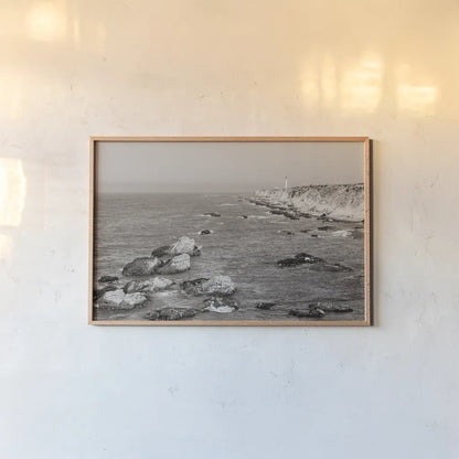 California Lighthouse BW by Nathan Larson. shown as a paper print in a natural frame. Available as a archival giclee rolled canvas, fine art paper, or poster print. SKU 90179i.