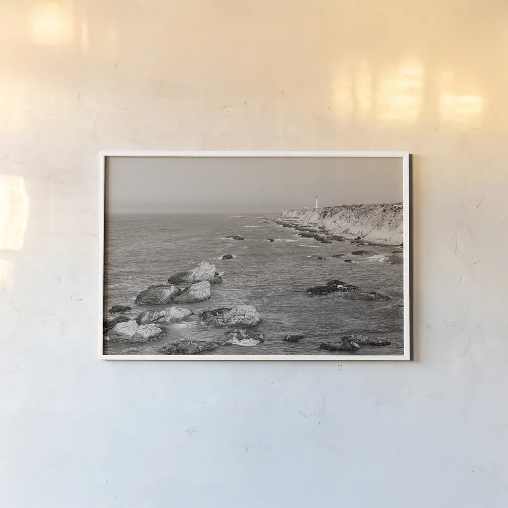 California Lighthouse BW by Nathan Larson. shown as a paper print in a white frame. Available as a archival giclee rolled canvas, fine art paper, or poster print. SKU 90179i.