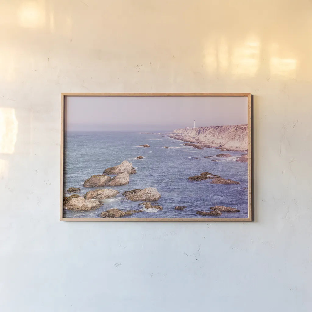 California Lighthouse Bright by Nathan Larson. shown as a paper print in a natural frame. Available as a archival giclee rolled canvas, fine art paper, or poster print. SKU 90178i.