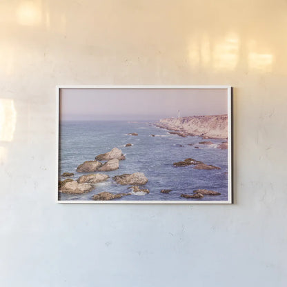 California Lighthouse Bright by Nathan Larson. shown as a paper print in a white frame. Available as a archival giclee rolled canvas, fine art paper, or poster print. SKU 90178i.
