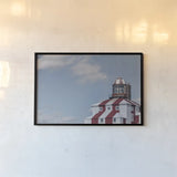 Cape Bona Vista Lighthouse I by Nathan Larson. shown as a paper print in a black flame. Available as a archival giclee rolled canvas, fine art paper, or poster print. SKU 103218i.