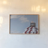 Cape Bona Vista Lighthouse I by Nathan Larson. shown as a paper print in a natural frame. Available as a archival giclee rolled canvas, fine art paper, or poster print. SKU 103218i.