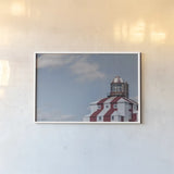Cape Bona Vista Lighthouse I by Nathan Larson. shown as a paper print in a white frame. Available as a archival giclee rolled canvas, fine art paper, or poster print. SKU 103218i.