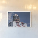 Cape Bona Vista Lighthouse II by Nathan Larson. shown as a paper print in a white frame. Available as a archival giclee rolled canvas, fine art paper, or poster print. SKU 103220i.