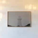 Cape Spear Lighthouse by Nathan Larson. shown as a paper print in a natural frame. Available as a archival giclee rolled canvas, fine art paper, or poster print. SKU 100500i.