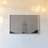 Cape Spear Lighthouse by Nathan Larson. shown as a paper print in a white frame. Available as a archival giclee rolled canvas, fine art paper, or poster print. SKU 100500i.