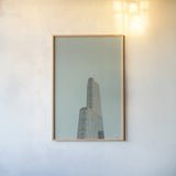Chicago Skies by Nathan Larson. shown as a paper print in a natural frame. Available as a archival giclee rolled canvas, fine art paper, or poster print. SKU 104874h.