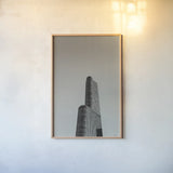 Chicago Skies BW by Nathan Larson. shown as a paper print in a natural frame. Available as a archival giclee rolled canvas, fine art paper, or poster print. SKU 104873h.