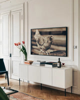 Chicken Barn V by Nathan Larson. shown as a framed stretched canvas in a living room above a console. Available as a archival giclee rolled canvas, fine art paper, or poster print. SKU 97959i.