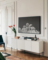 City of Rocks Formation by Nathan Larson. shown as a framed stretched canvas in a living room above a console. Available as a archival giclee rolled canvas, fine art paper, or poster print. SKU 73734i.