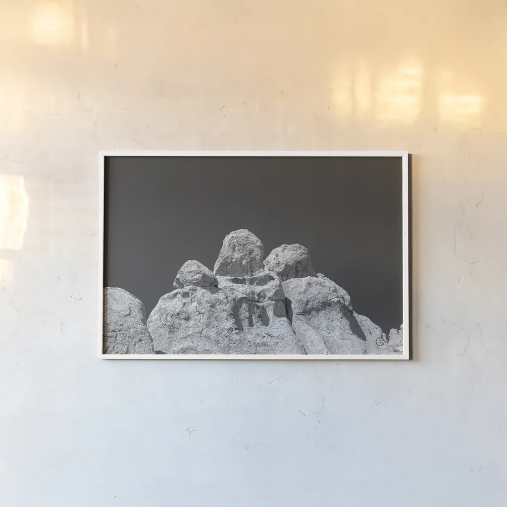 City of Rocks Formation by Nathan Larson. shown as a paper print in a white frame. Available as a archival giclee rolled canvas, fine art paper, or poster print. SKU 73734i.