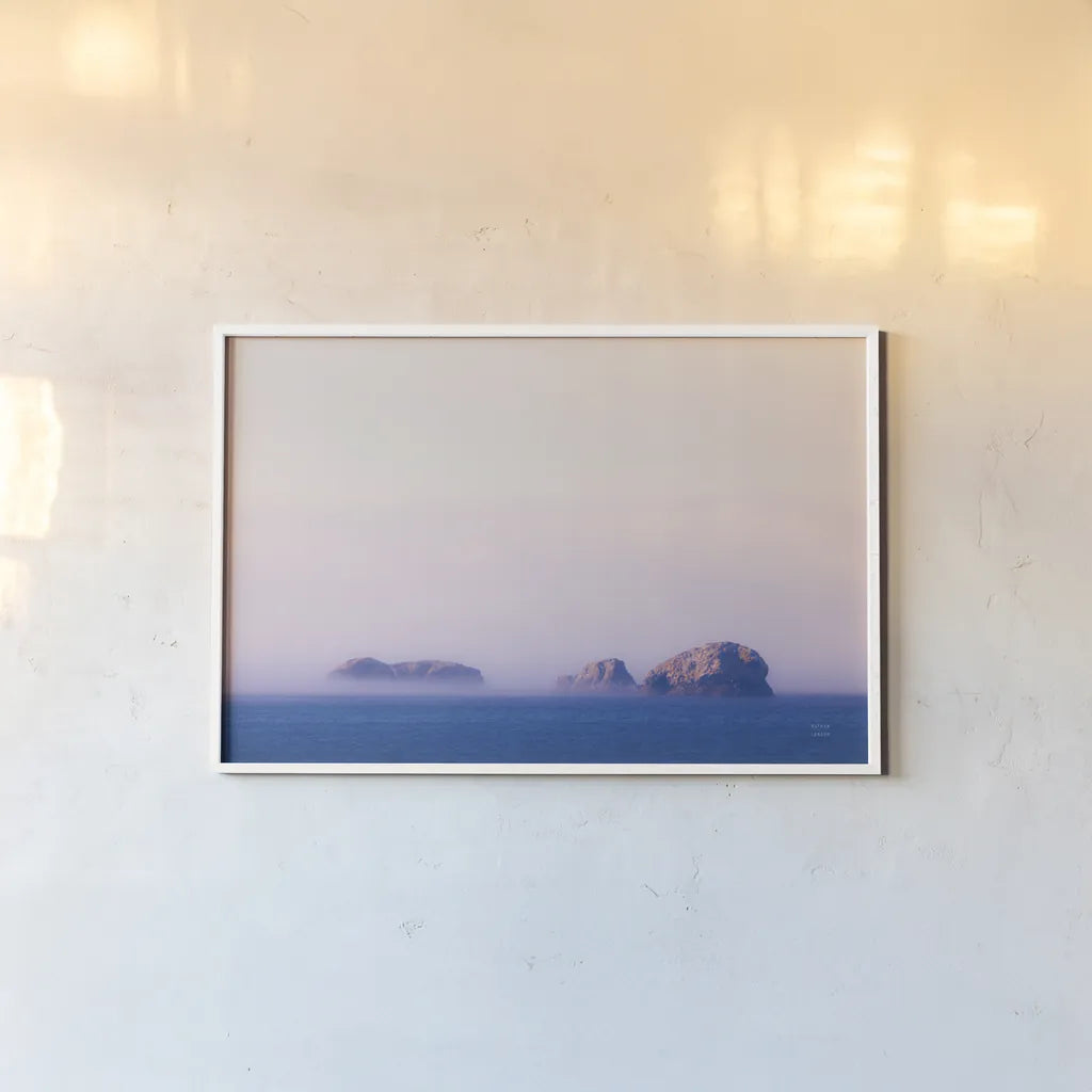Coastline Sunset  by Nathan Larson. shown as a paper print in a white frame. Available as a archival giclee rolled canvas, fine art paper, or poster print. SKU 90180i.