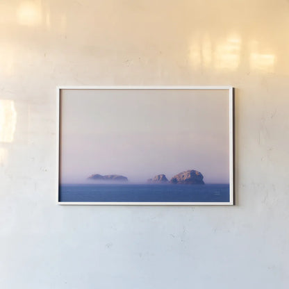 Coastline Sunset  by Nathan Larson. shown as a paper print in a white frame. Available as a archival giclee rolled canvas, fine art paper, or poster print. SKU 90180i.