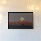 Cold Moon by Nathan Larson. shown as a paper print in a black flame. Available as a archival giclee rolled canvas, fine art paper, or poster print. SKU 103217i.