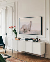 Colorado Open Range by Nathan Larson. shown as a framed stretched canvas in a living room above a console. Available as a archival giclee rolled canvas, fine art paper, or poster print. SKU 104267i.