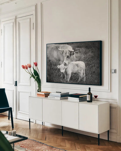 Cow Care by Nathan Larson. shown as a framed stretched canvas in a living room above a console. Available as a archival giclee rolled canvas, fine art paper, or poster print. SKU 71165i.