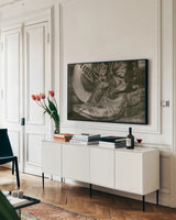 Cowboy Boots I by Nathan Larson. shown as a framed stretched canvas in a living room above a console. Available as a archival giclee rolled canvas, fine art paper, or poster print. SKU 82727i.
