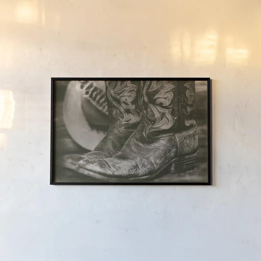 Cowboy Boots I by Nathan Larson. shown as a paper print in a black flame. Available as a archival giclee rolled canvas, fine art paper, or poster print. SKU 82727i.