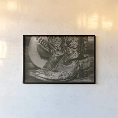Cowboy Boots I by Nathan Larson. shown as a paper print in a black flame. Available as a archival giclee rolled canvas, fine art paper, or poster print. SKU 82727i.