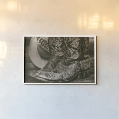 Cowboy Boots I by Nathan Larson. shown as a paper print in a white frame. Available as a archival giclee rolled canvas, fine art paper, or poster print. SKU 82727i.