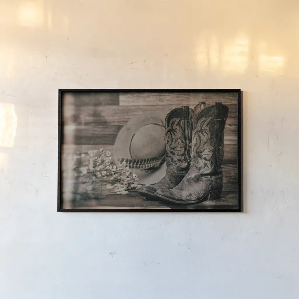 Cowboy Boots III by Nathan Larson. shown as a paper print in a black flame. Available as a archival giclee rolled canvas, fine art paper, or poster print. SKU 82729i.