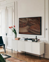 Cowboy Boots IV Warm by Nathan Larson. shown as a framed stretched canvas in a living room above a console. Available as a archival giclee rolled canvas, fine art paper, or poster print. SKU 82737i.