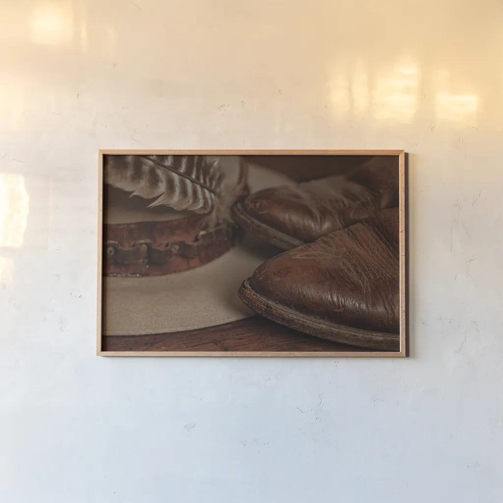 Cowboy Boots IV Warm by Nathan Larson. shown as a paper print in a natural frame. Available as a archival giclee rolled canvas, fine art paper, or poster print. SKU 82737i.