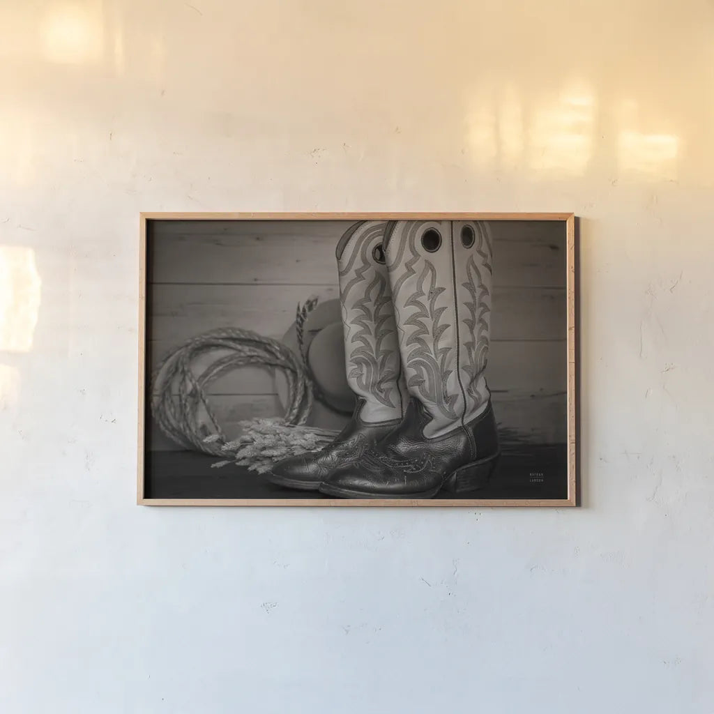 Cowboy Boots IX by Nathan Larson. shown as a paper print in a natural frame. Available as a archival giclee rolled canvas, fine art paper, or poster print. SKU 82735i.