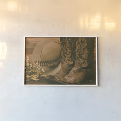 Cowboy Boots V by Nathan Larson. shown as a paper print in a white frame. Available as a archival giclee rolled canvas, fine art paper, or poster print. SKU 82731i.