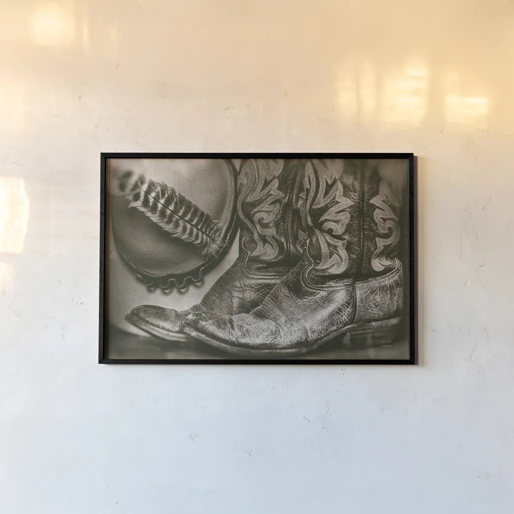 Cowboy Boots VII by Nathan Larson. shown as a paper print in a black flame. Available as a archival giclee rolled canvas, fine art paper, or poster print. SKU 82733i.
