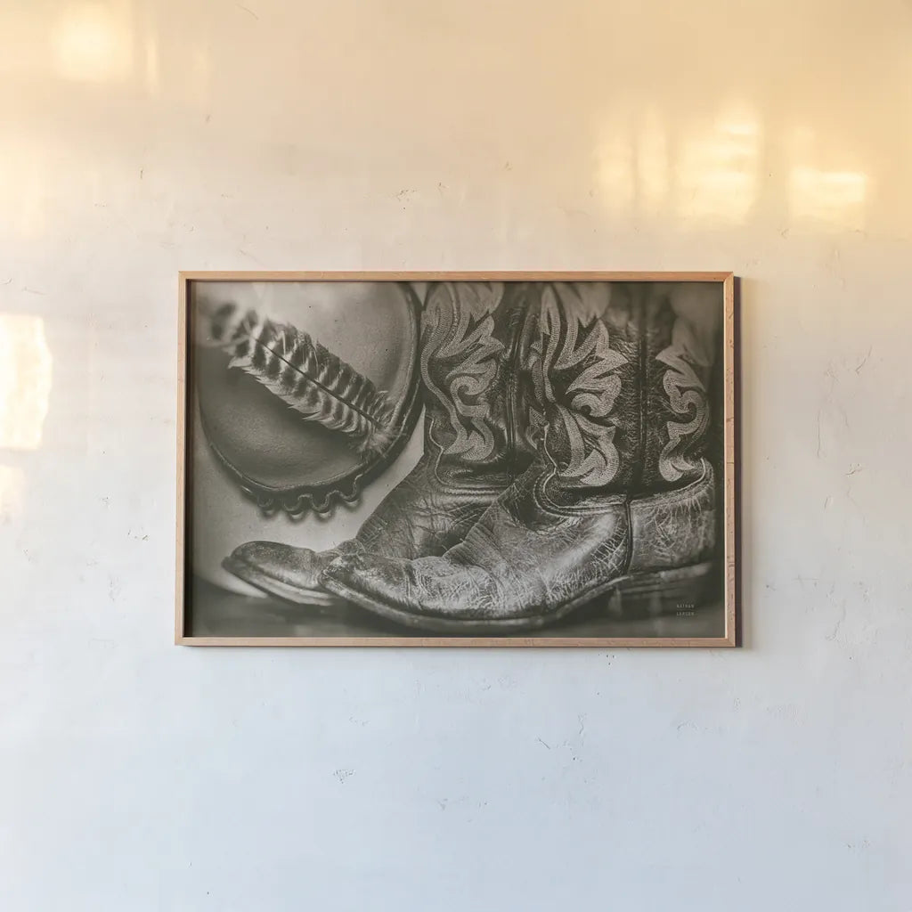 Cowboy Boots VII by Nathan Larson. shown as a paper print in a natural frame. Available as a archival giclee rolled canvas, fine art paper, or poster print. SKU 82733i.
