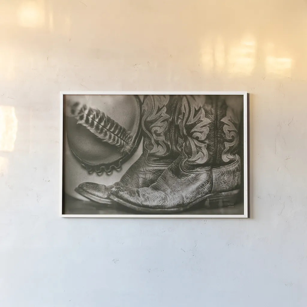 Cowboy Boots VII by Nathan Larson. shown as a paper print in a white frame. Available as a archival giclee rolled canvas, fine art paper, or poster print. SKU 82733i.