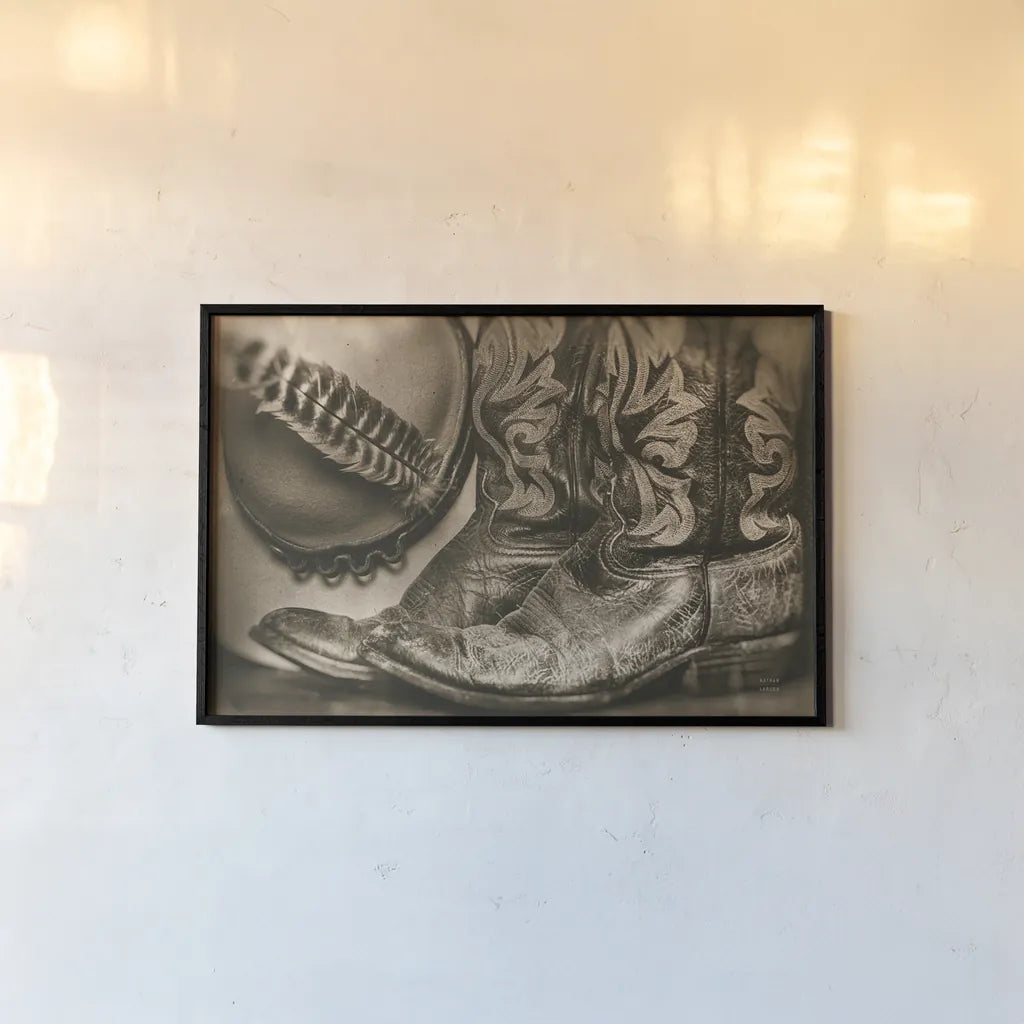 Cowboy Boots VII Sepia by Nathan Larson. shown as a paper print in a black flame. Available as a archival giclee rolled canvas, fine art paper, or poster print. SKU 83666i.