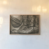 Cowboy Boots VII Sepia by Nathan Larson. shown as a paper print in a natural frame. Available as a archival giclee rolled canvas, fine art paper, or poster print. SKU 83666i.