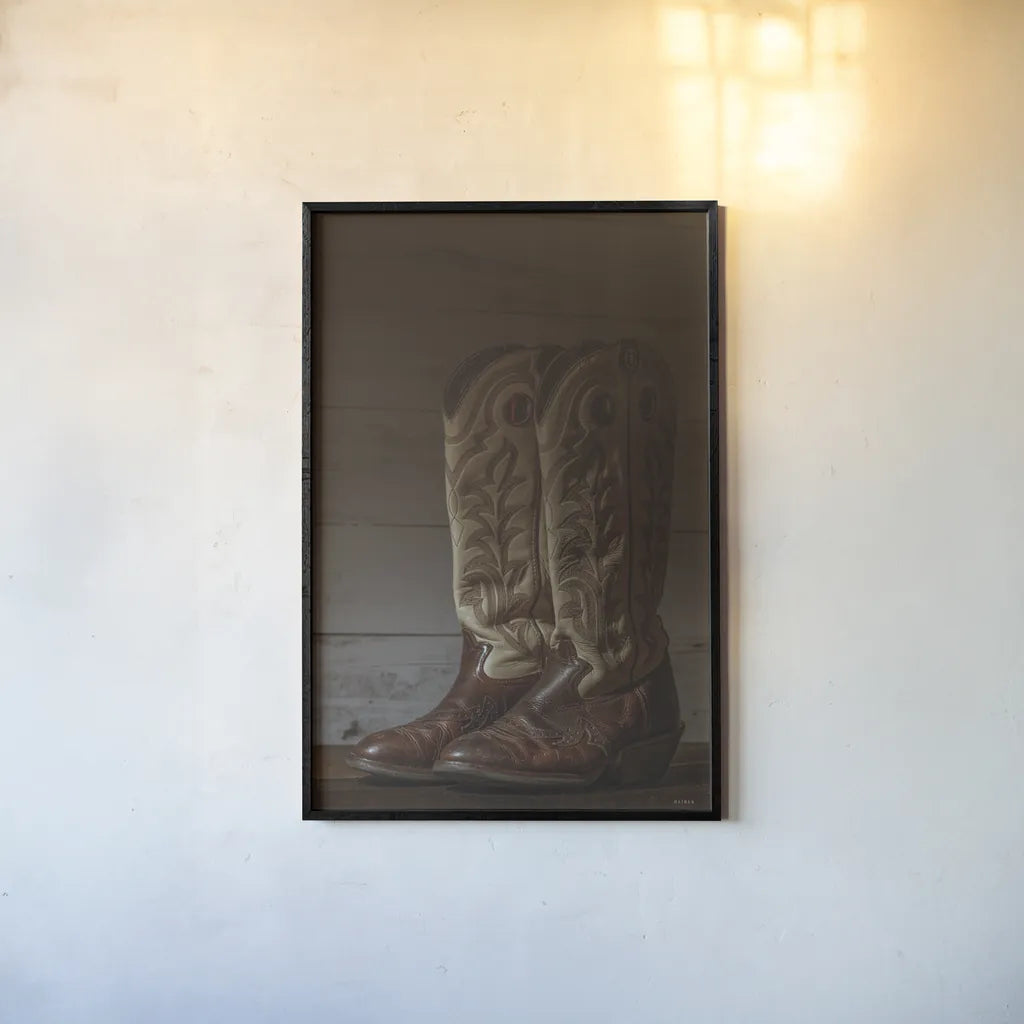 Cowboy Boots VIII by Nathan Larson. shown as a paper print in a black flame. Available as a archival giclee rolled canvas, fine art paper, or poster print. SKU 82734h.