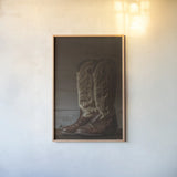 Cowboy Boots VIII by Nathan Larson. shown as a paper print in a natural frame. Available as a archival giclee rolled canvas, fine art paper, or poster print. SKU 82734h.