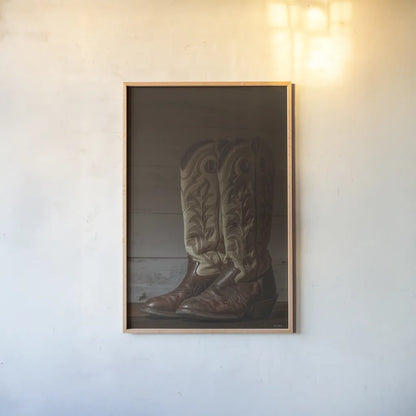 Cowboy Boots VIII by Nathan Larson. shown as a paper print in a natural frame. Available as a archival giclee rolled canvas, fine art paper, or poster print. SKU 82734h.
