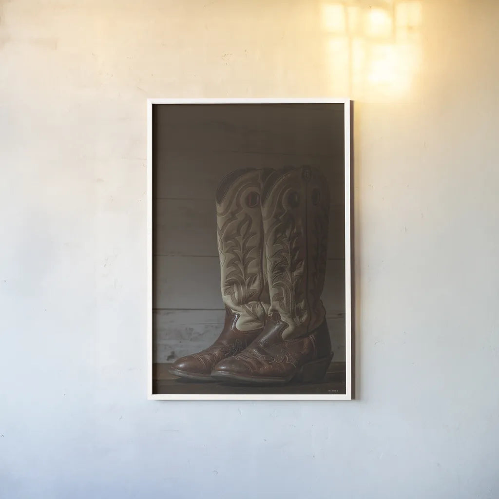 Cowboy Boots VIII by Nathan Larson. shown as a paper print in a white frame. Available as a archival giclee rolled canvas, fine art paper, or poster print. SKU 82734h.