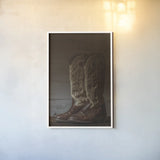 Cowboy Boots VIII by Nathan Larson. shown as a paper print in a white frame. Available as a archival giclee rolled canvas, fine art paper, or poster print. SKU 82734h.