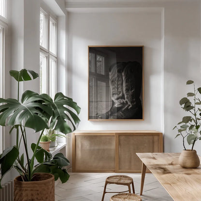 Cowboy Boots VIII BW by Nathan Larson. shown as a print in a natural wood frame in a dining room. Available as a archival giclee rolled canvas, fine art paper, or poster print. SKU 82739h.