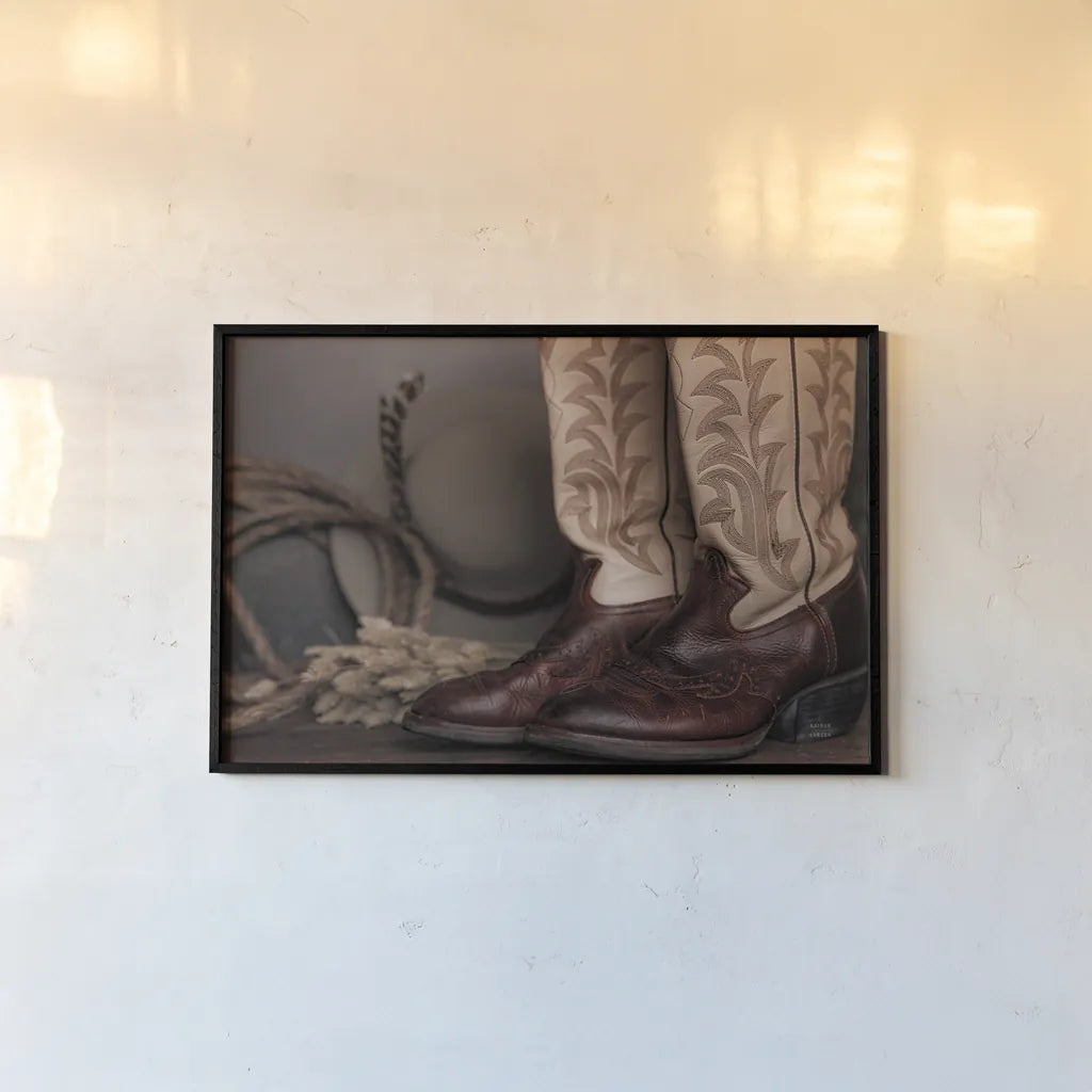 Cowboy Boots XI by Nathan Larson. shown as a paper print in a black flame. Available as a archival giclee rolled canvas, fine art paper, or poster print. SKU 82736i.