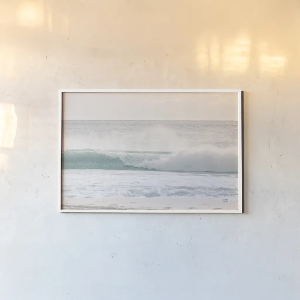 Curling Blue by Nathan Larson. shown as a paper print in a white frame. Available as a archival giclee rolled canvas, fine art paper, or poster print. SKU 82385i.