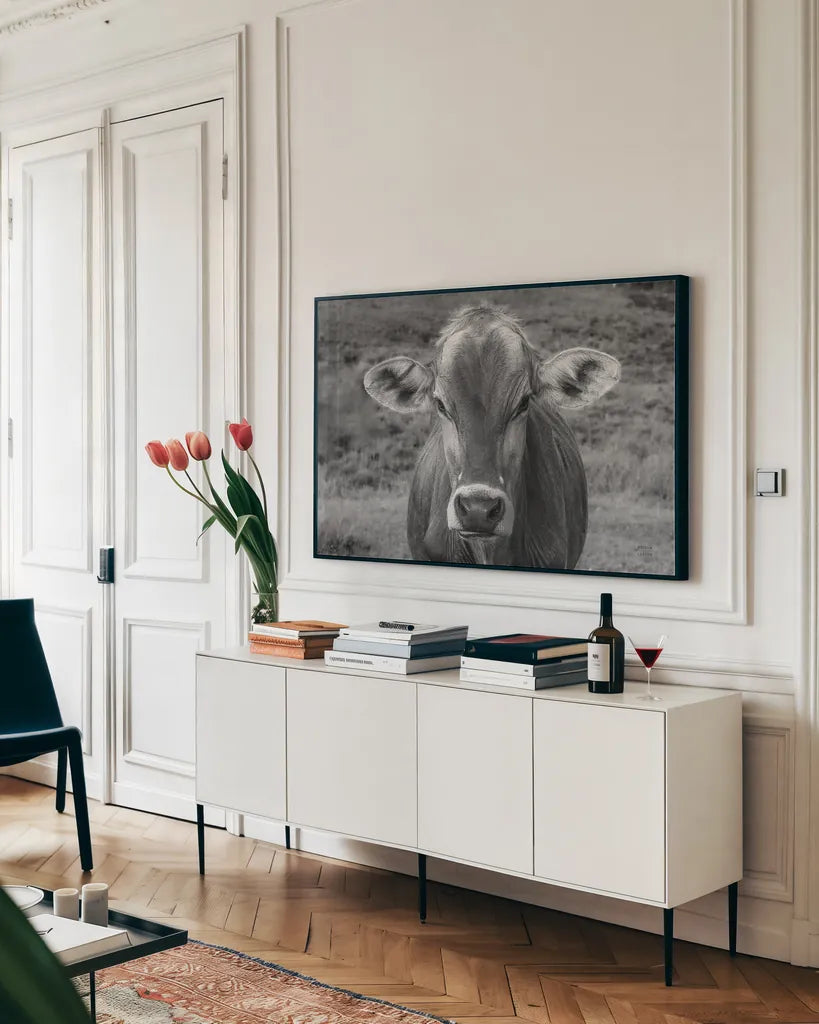 Dairy Barn BW by Nathan Larson. shown as a framed stretched canvas in a living room above a console. Available as a archival giclee rolled canvas, fine art paper, or poster print. SKU 82815i.