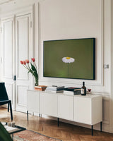 Daisy Up by Nathan Larson. shown as a framed stretched canvas in a living room above a console. Available as a archival giclee rolled canvas, fine art paper, or poster print. SKU 102286i.