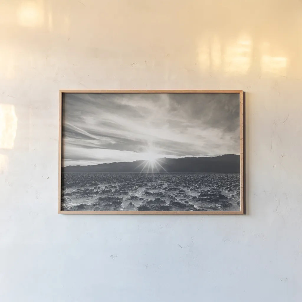 Death Valley Sunset by Nathan Larson. shown as a paper print in a natural frame. Available as a archival giclee rolled canvas, fine art paper, or poster print. SKU 96622i.