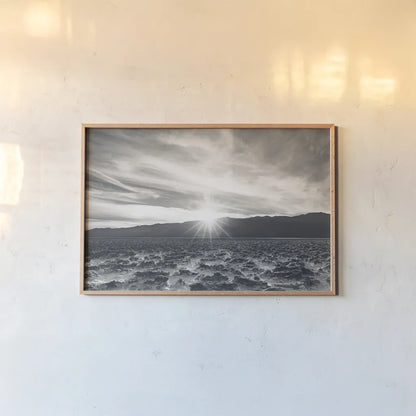 Death Valley Sunset by Nathan Larson. shown as a paper print in a natural frame. Available as a archival giclee rolled canvas, fine art paper, or poster print. SKU 96622i.