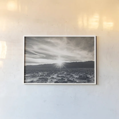 Death Valley Sunset by Nathan Larson. shown as a paper print in a white frame. Available as a archival giclee rolled canvas, fine art paper, or poster print. SKU 96622i.