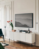 Deep in the Lost Coast by Nathan Larson. shown as a framed stretched canvas in a living room above a console. Available as a archival giclee rolled canvas, fine art paper, or poster print. SKU 88888i.